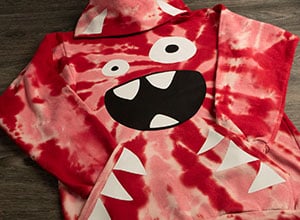 Image depicting the downloadable cut file that is a monster face meant to be placed on a hoodie or long sleeve shirt.