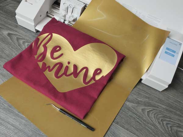 The finished shirt resting on a sheet of ThermoFlex Plus and the Silhouette Cameo 3