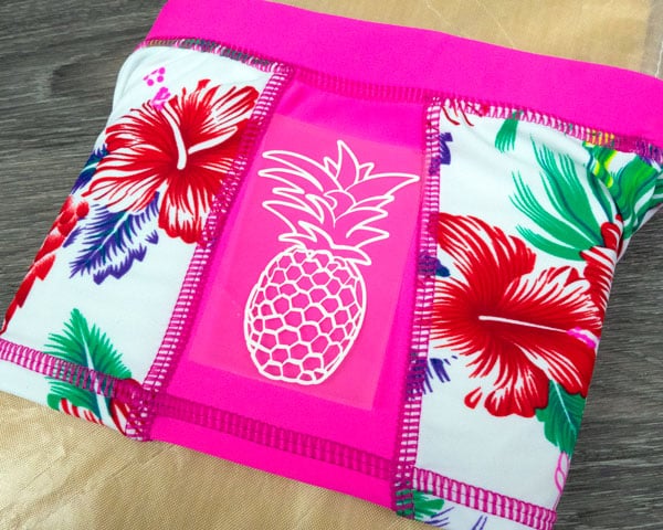 Since there are seams on the site of these swim shorts, we use a pressing pillow to prevent pressing onto seams
