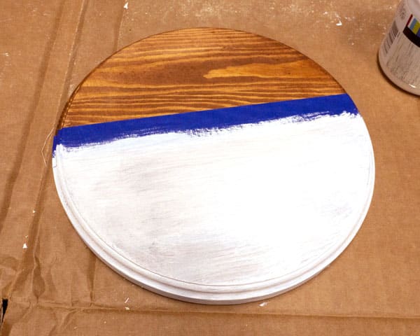 The door round after one coat of paint- the wood grain and stain is still visible and it needs another coat