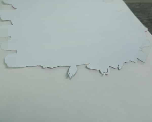 A close up of the GlitterFlex Ultra lined up with the sublimation design and taped down with ThermoTape