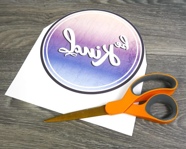 The sublimation paper being cut around one edge, making it easier to line up